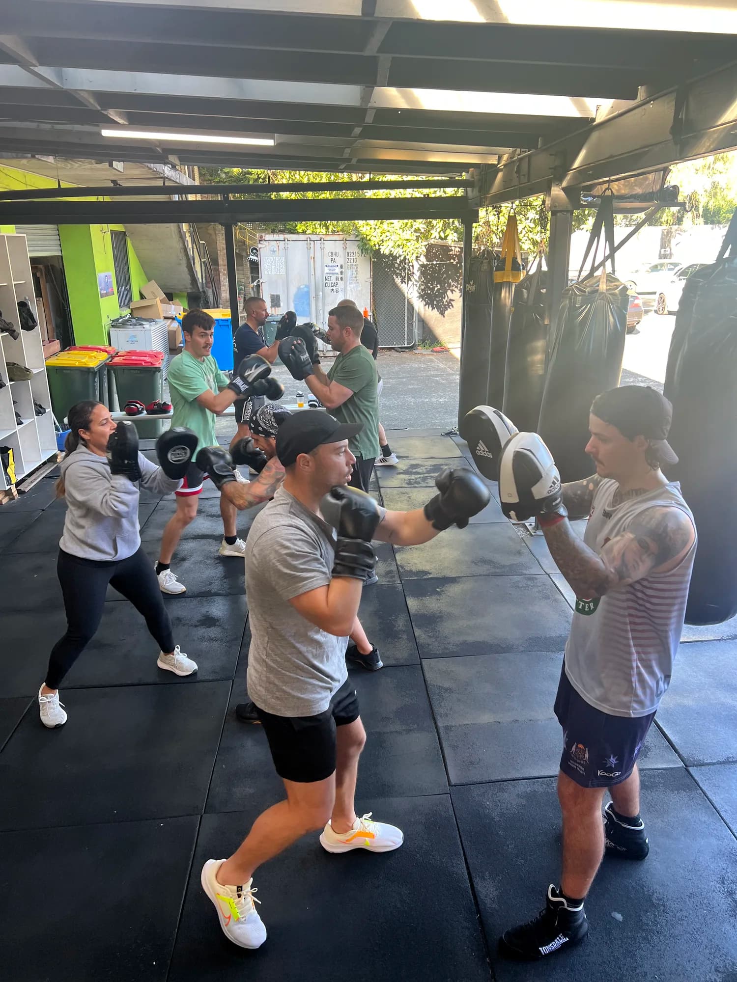 Legends Gym members practising boxing combinations in class