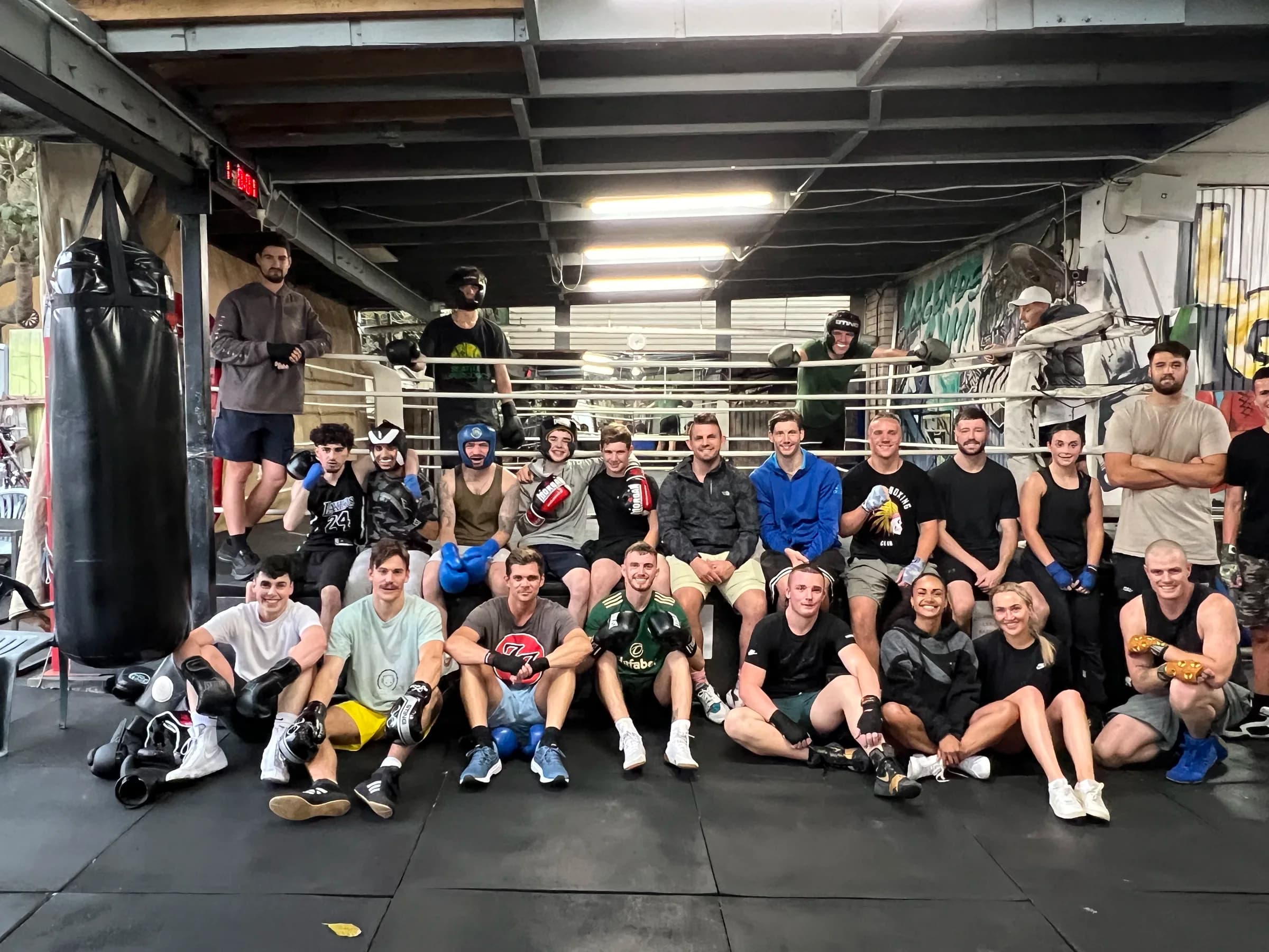 Legends Gym members gathered around the boxing ring
